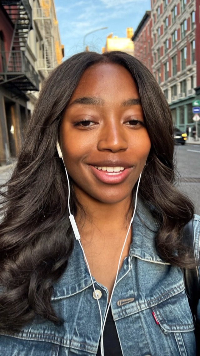 A creator vlogging on a city street, with captions