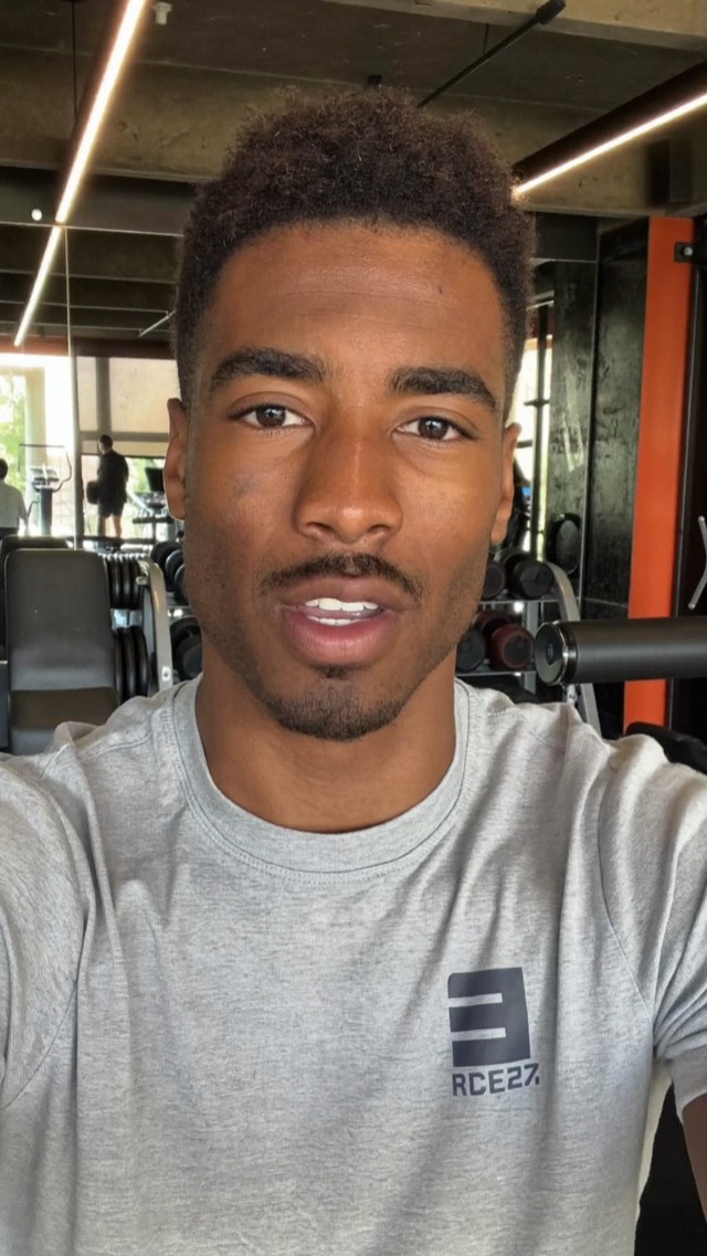 A trainer talking to camera in a gym, with a title, a stat popping in and captions